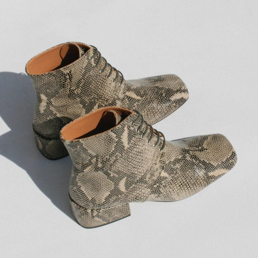 About Arienne GABRIEL snake skin lace up boot in White Mamba. Available at EASE Toronto.