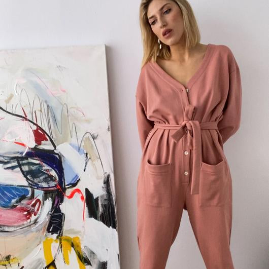 In Soft Focus Jogger Jumpsuit in Baked Coral. Available at EASE Toronto.