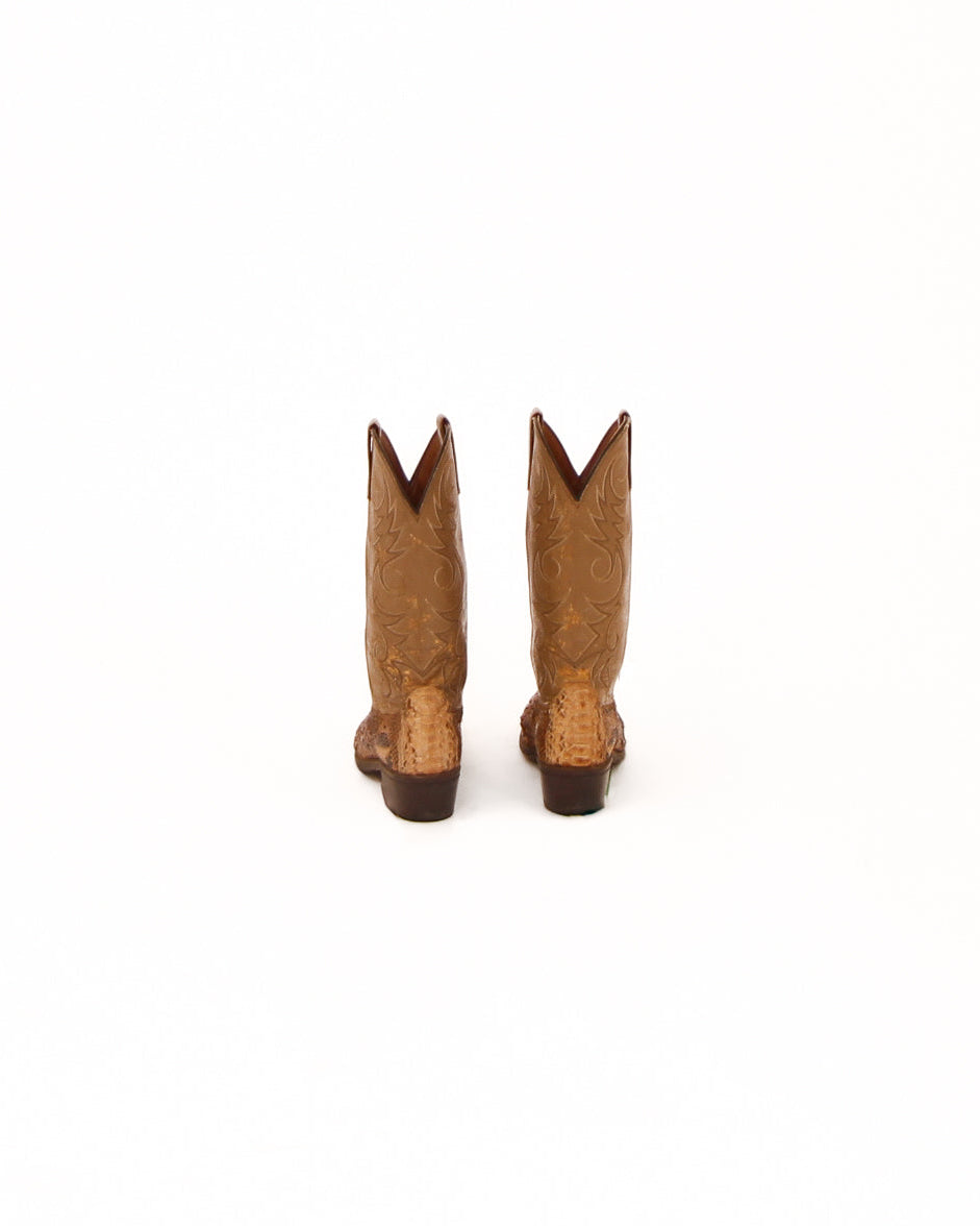 Pair of brown cowboy boots on a white background