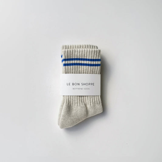Gray socks with blue stripes on a white background, featuring 'Le Bon Shoppe' branding.