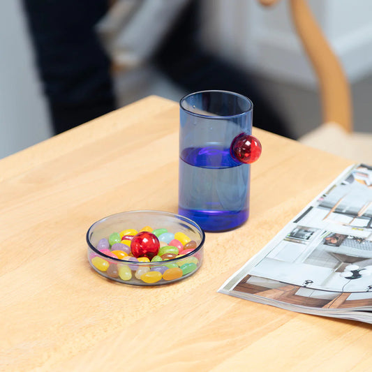 Handmade borosilicate glass dish available in 2 sizes. Perfect for the dining table, desk or bedside, our food-grade dish features a playful bubble around which to arrange snacks, stationery or jewellery.