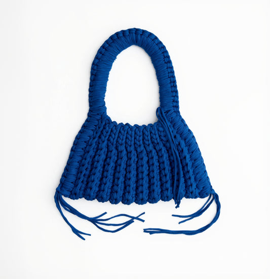 Blue woven handbag on a white background