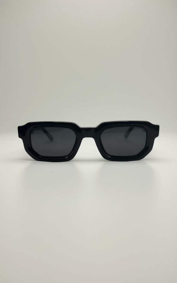 Black sunglasses with dark lenses on a white background