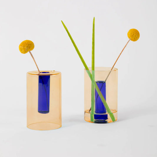 Use the glass cylinder vases one way for a small arrangement or turn around to create a single stem bud vase.