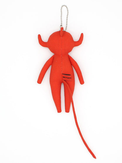Red plush keychain shaped like a stylized figure on a white background