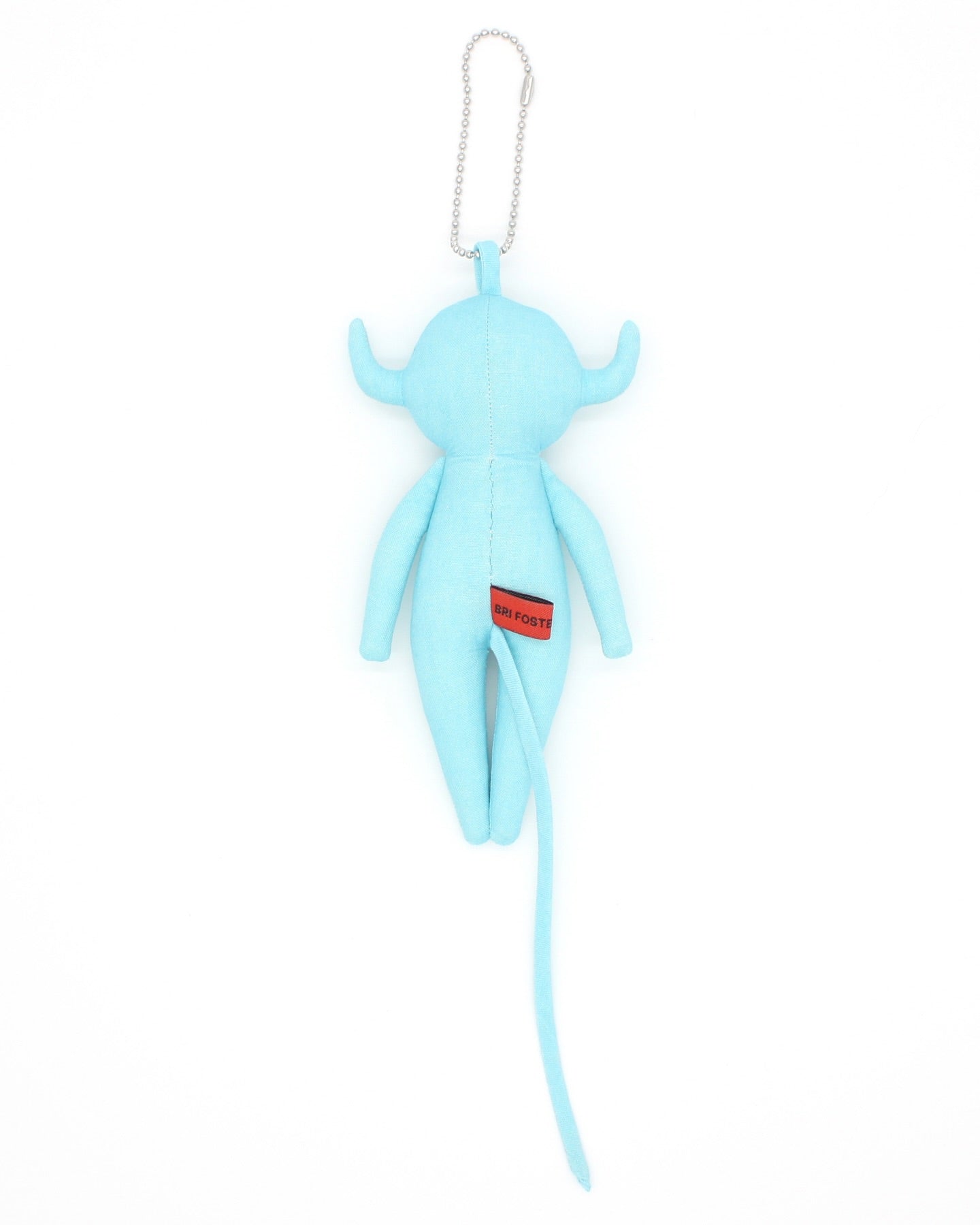 Blue plush toy devil charm with floral design eyes on a white background