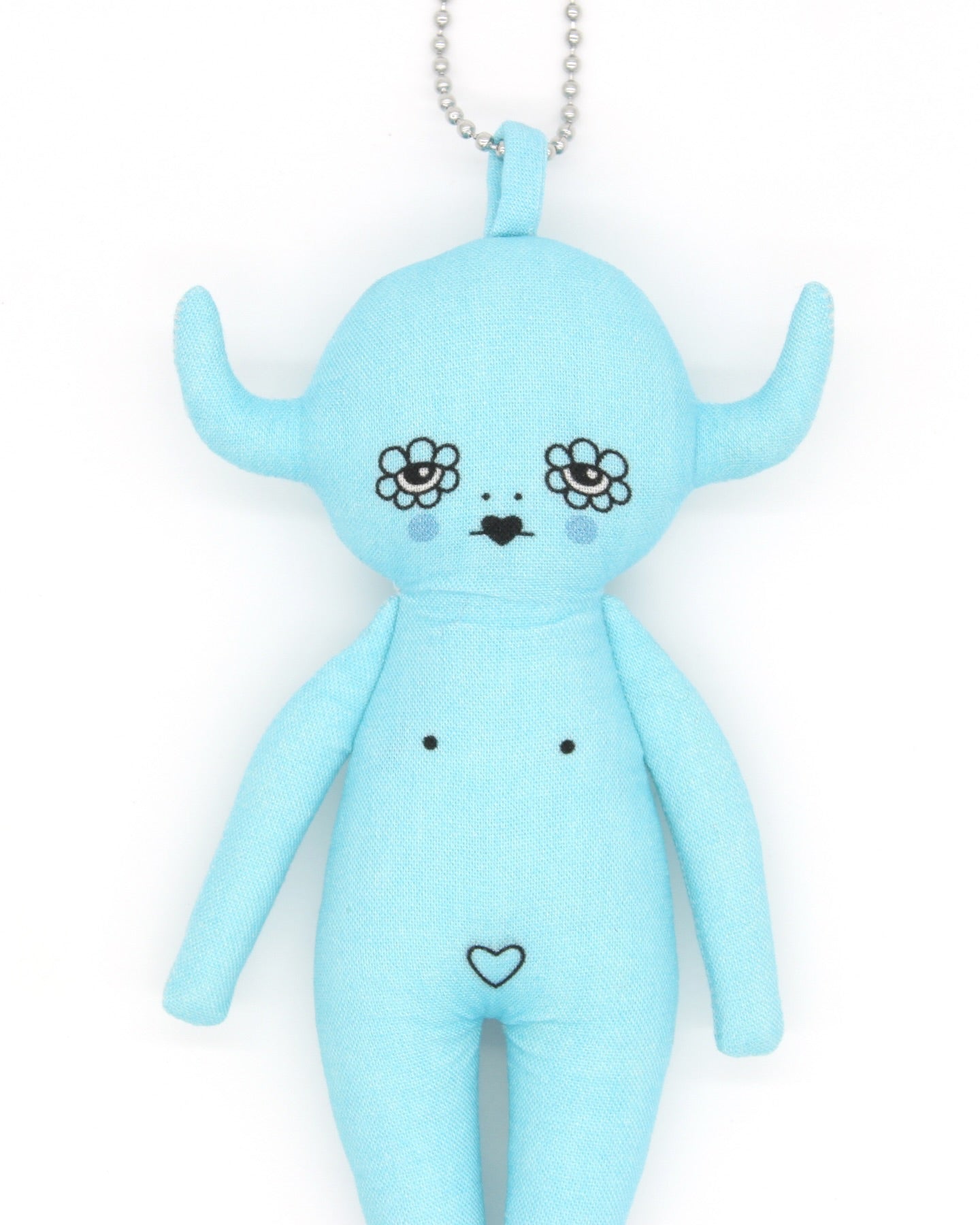 Blue plush toy devil charm with floral design eyes on a white background