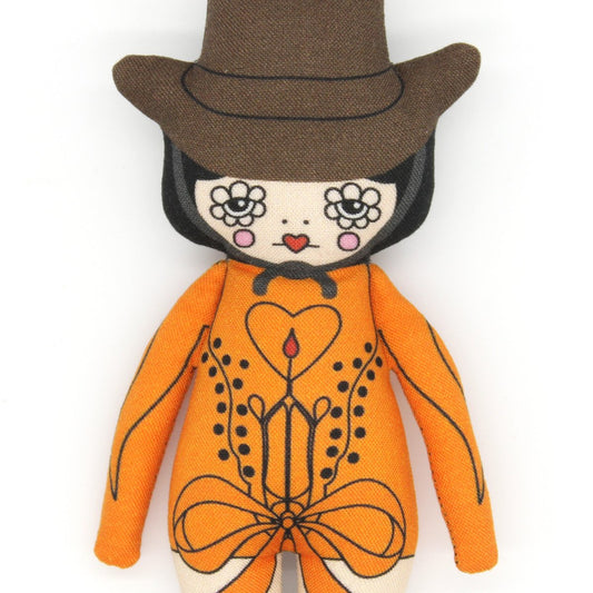 Plush toy with orange outfit, brown hat, and black boots on a white background