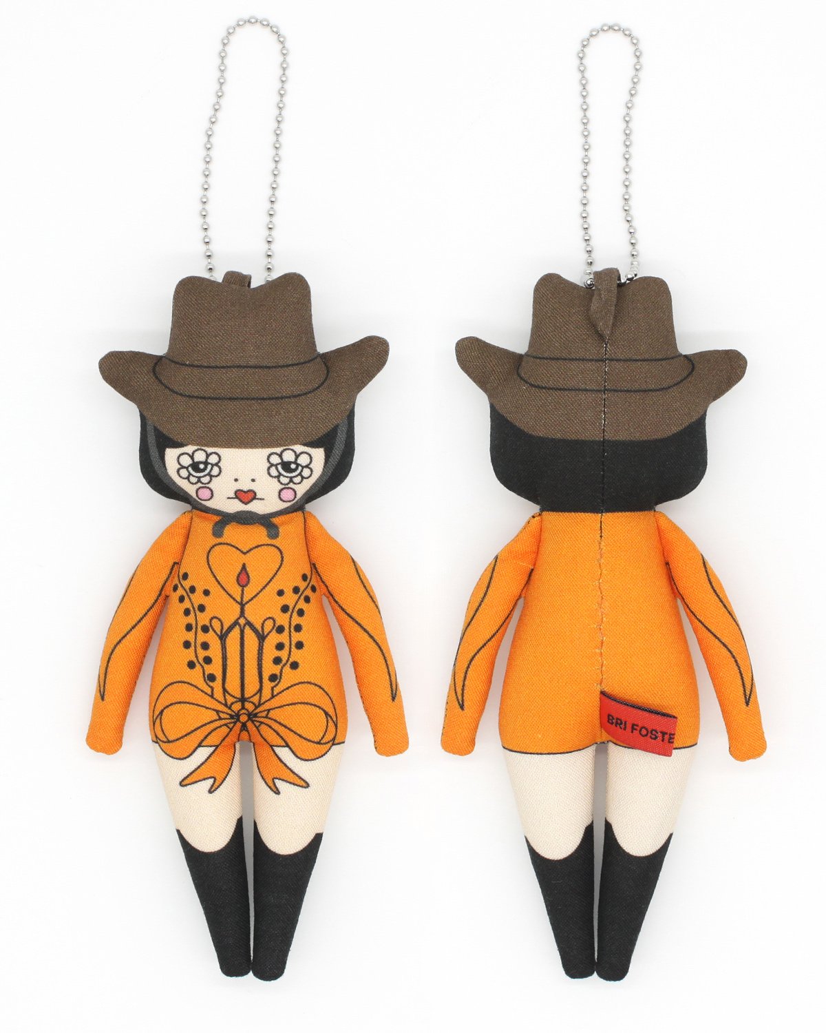 Two decorative dolls with orange outfits and brown hats on a white background
