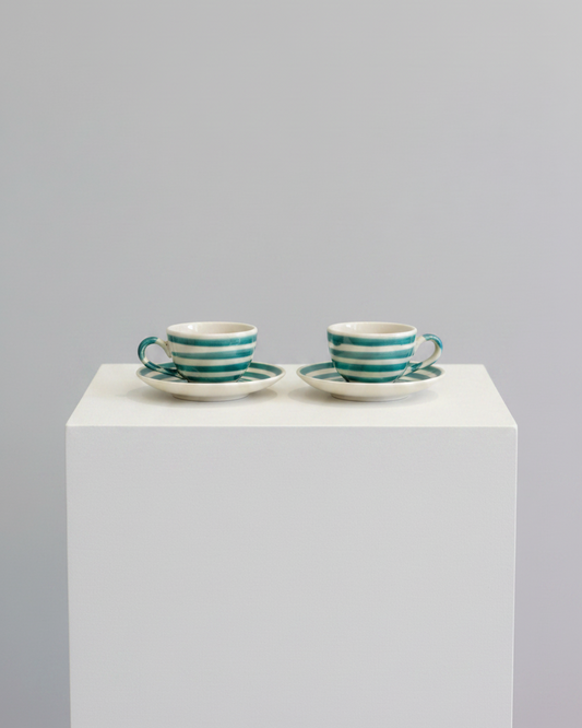Cups with saucers on pedestal