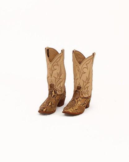 Pair of brown cowboy boots on a white background