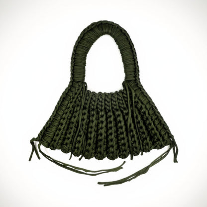 Green woven handbag on a white background