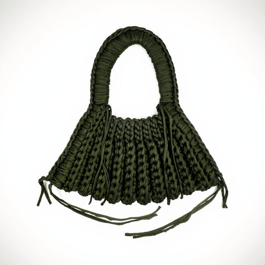 Green woven handbag on a white background