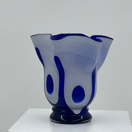Blue and white glass vase on a white background
