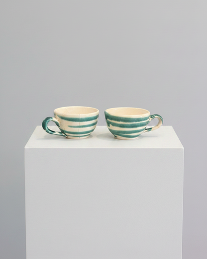 Espresso cups on white pedestal
