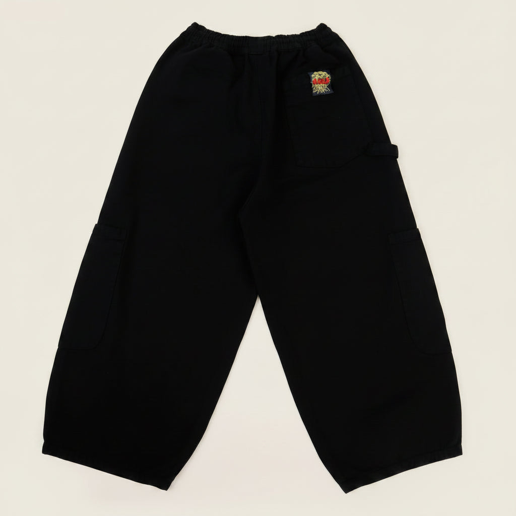 Black pants with a brand logo on a white background