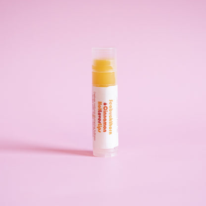 Living Libations Seabuckthorn Cinnamon Hot Lover Lips balm. Available at Easy Tiger Toronto.