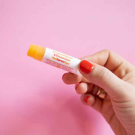 Living Libations Seabuckthorn Cinnamon Hot Lover Lips balm. Available at Easy Tiger Toronto.