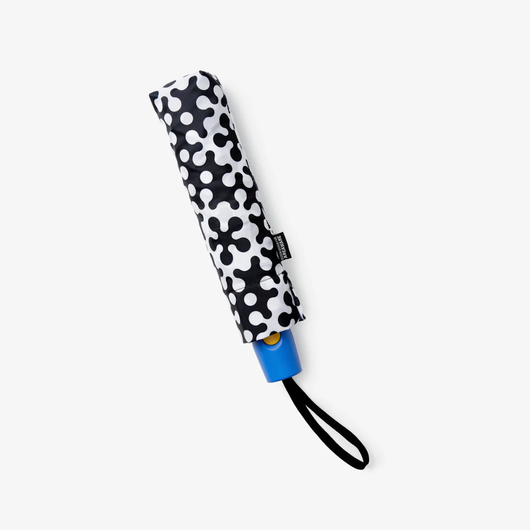 Dusen Dusen Atom Umbrella with bold black and white graphic pattern pop of yellow on top and blue handle